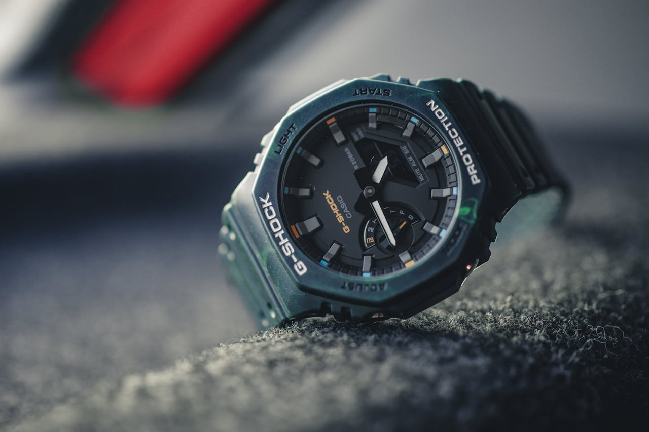 Stylish G-Shock wristwatch captured in a modern product photography setting.