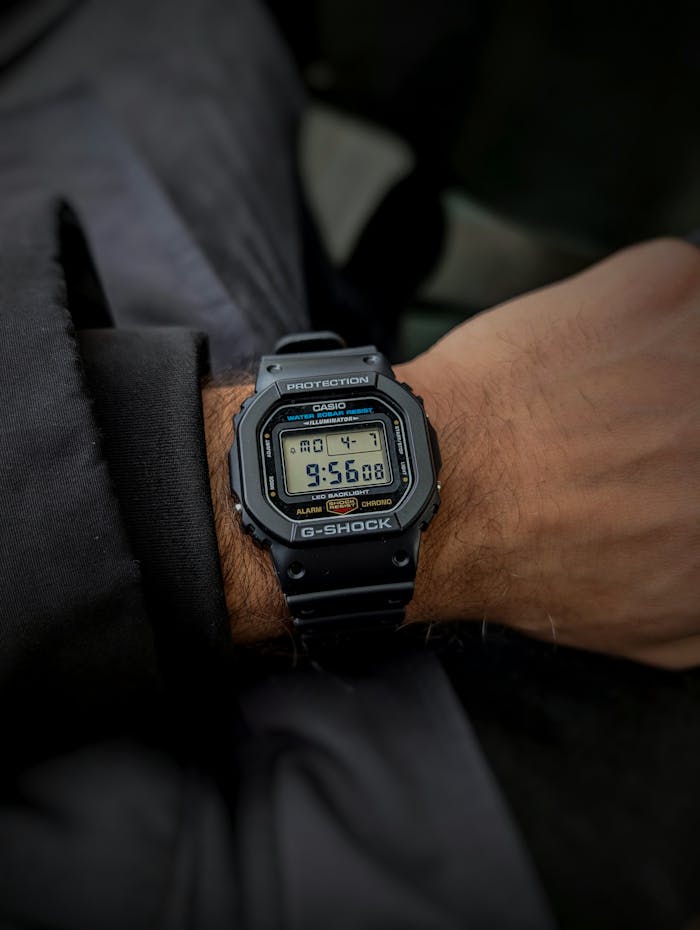 Detailed view of a Casio G-Shock watch on an adult's wrist in Canada.